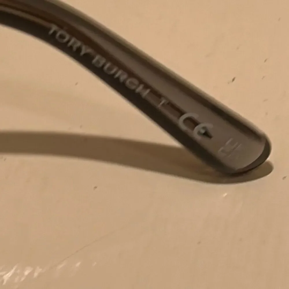 Tory Burch TY7207U Sunglasses Smoke Metallic Cream Trim Bold Futuristic Luxury